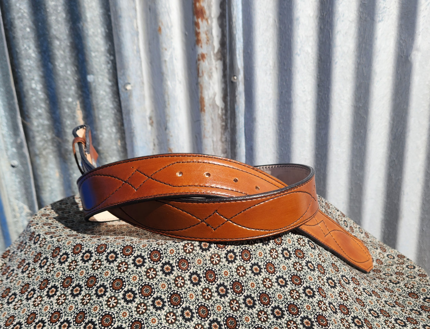 Light Golden brown gunslinger stitched belts.