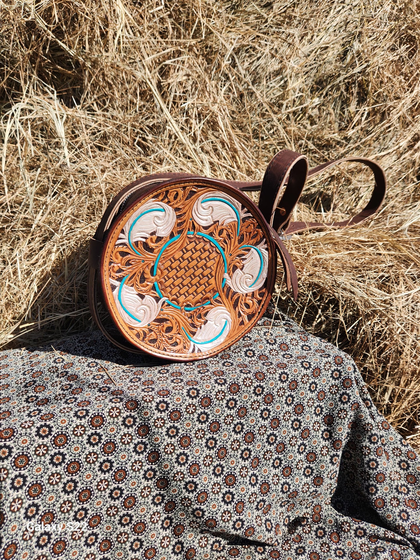 Feather tooled round purse