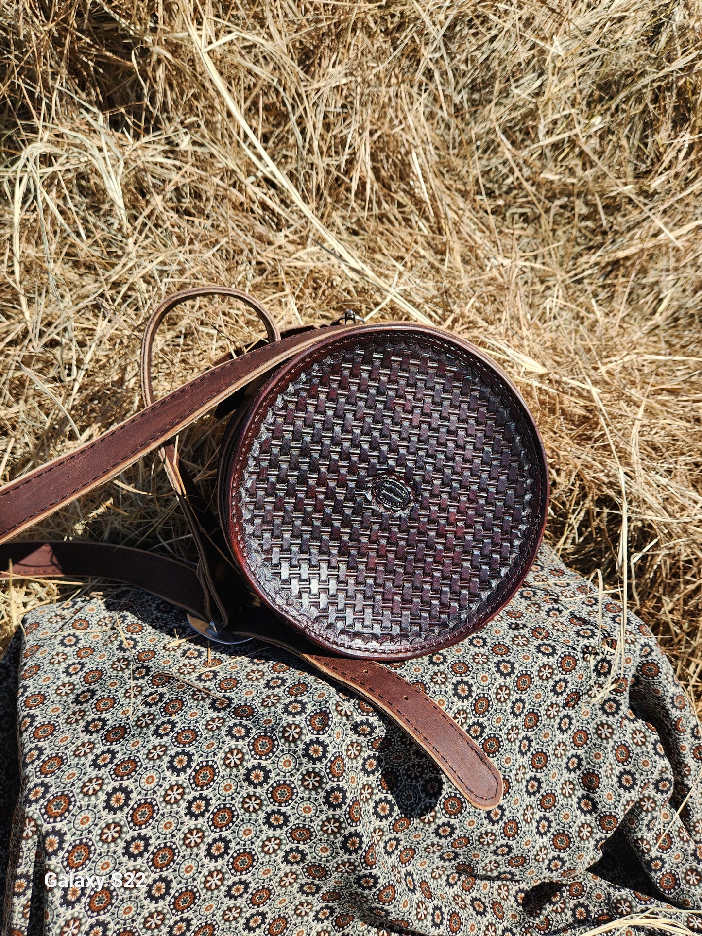Feather tooled round purse