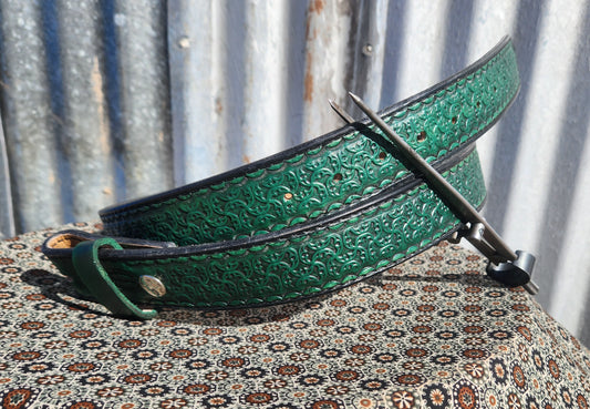Green stamped belt with black edges.